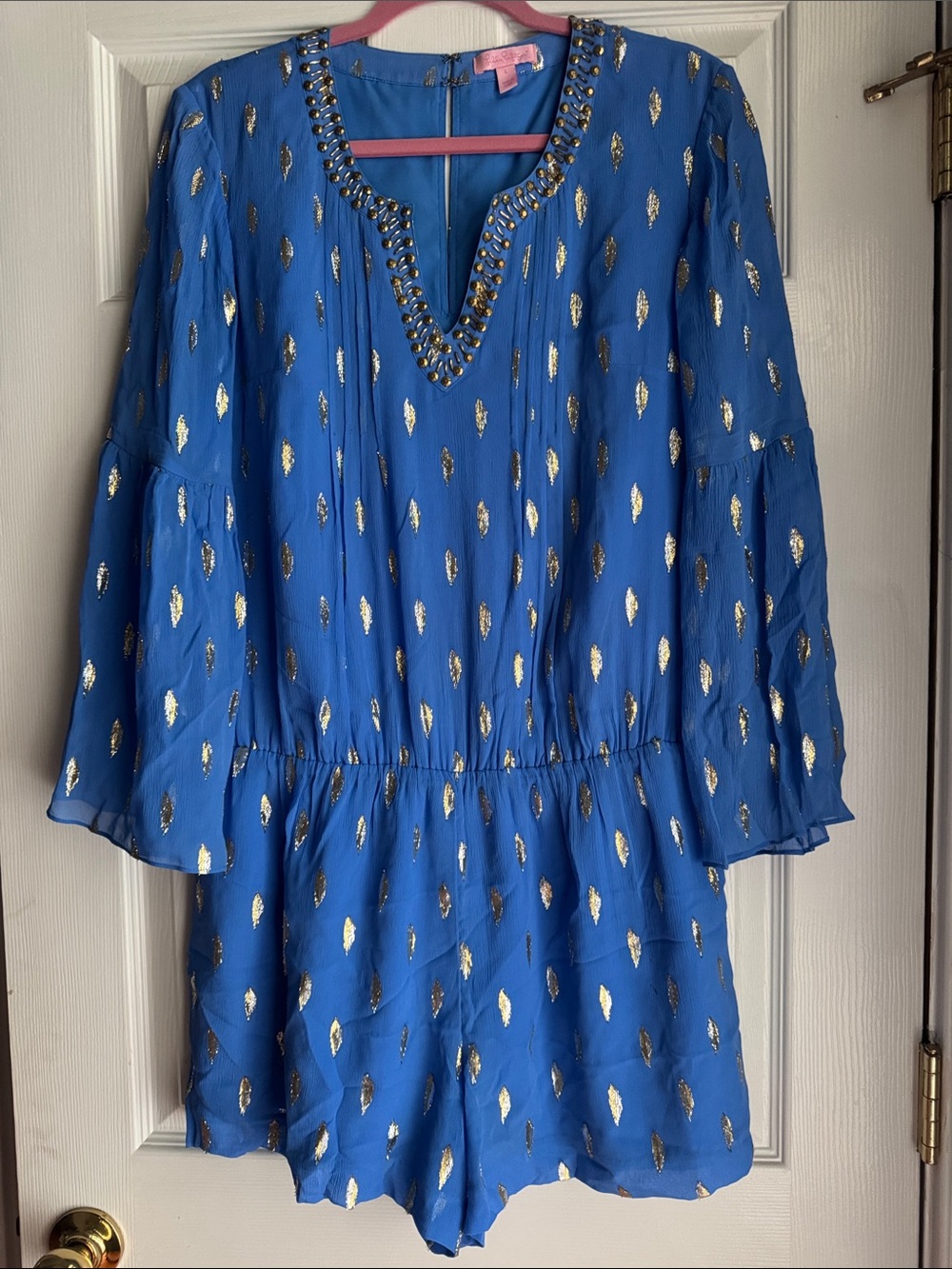 Lilly Pulitzer Blue Romper with Pink Label and Gold Foil Detail.